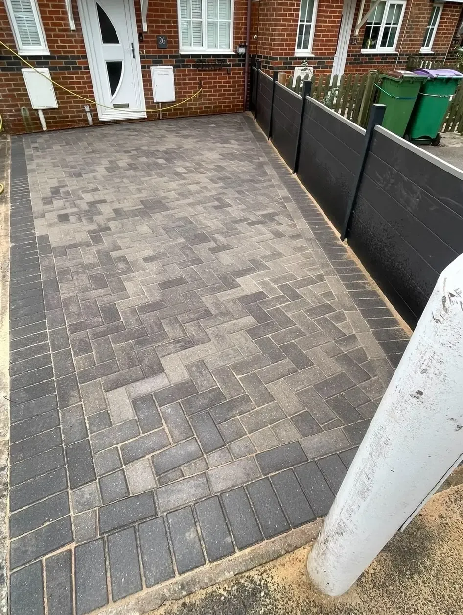 A picture of a newly laid block paving driveway with a herringbone design