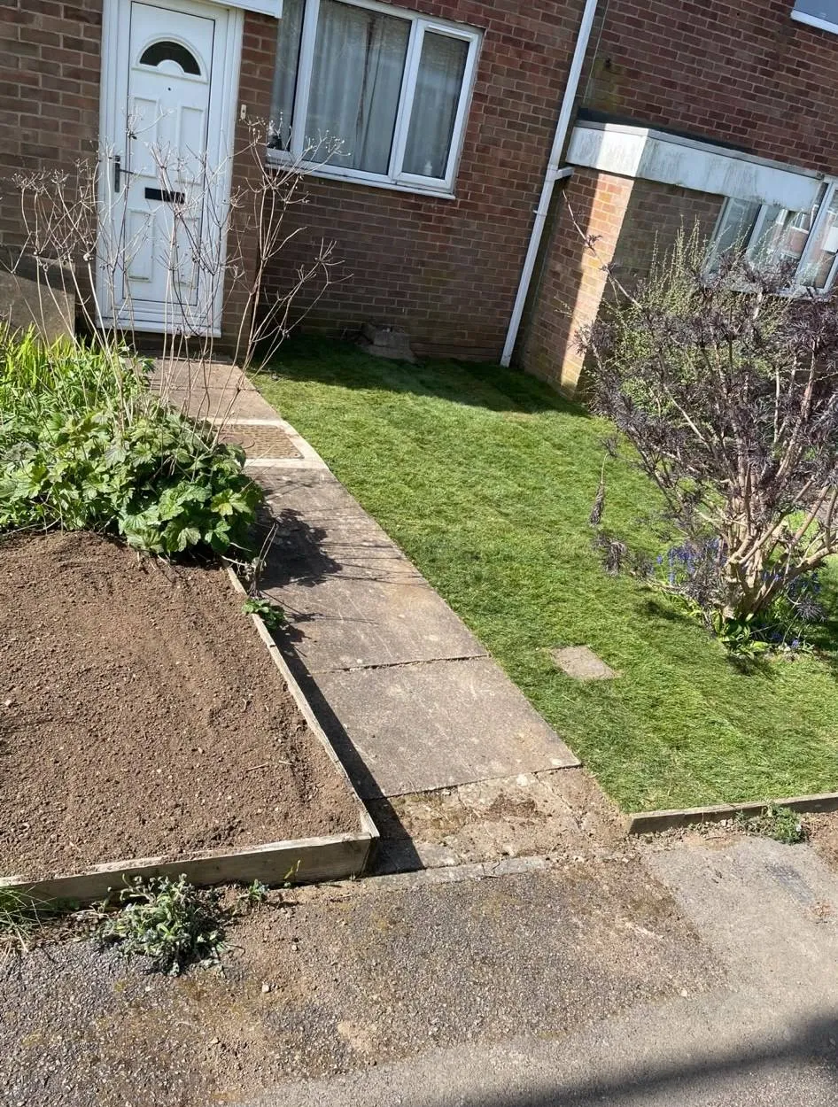 Fresh turfing and ground preparation for a front garden landscaping project in Northampton