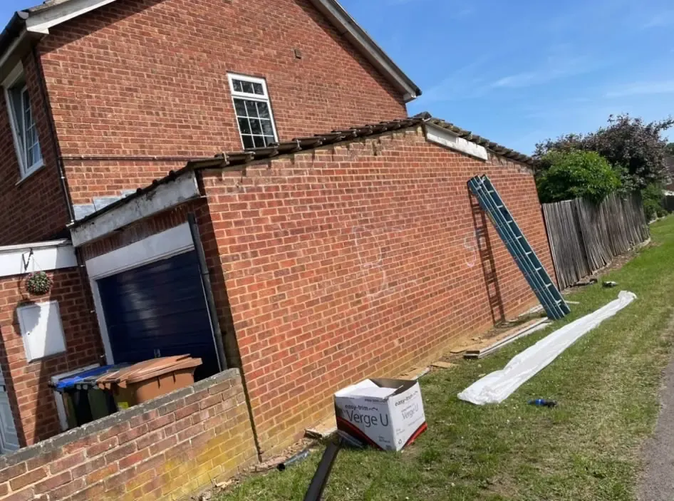 A picture of a garage undergoing roof repairs